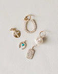 Naomi Eloise: 14k Gold Diamond Charms