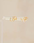 Naomi Eloise: 14k Diamond LO-VE Stud Earrings