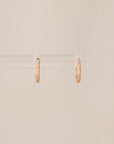 Naomi Eloise: 14k Gold Diamond Baby Huggie Earrings