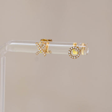 Naomi Eloise:  14k Gold Diamond Tiny X O Earrings